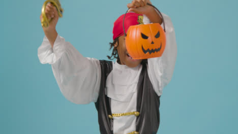 Mid-Shot-of-Boy-Dressed-Up-Saying-Trick-or-Treat